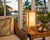 Bamboo Island table lamp V114L styled beside woven seating in a bright coastal interior with its natural bamboo frame clearly visible.