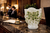Green and ivory floral ceramic vase styled as a decorative accent in a refined interior setting.