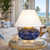 Handmade blue ceramic coastal table lamp displayed in an upscale coastal living room