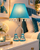 Turquoise Eve designer table lamp styled in a colorful teen bedroom with silver-tone legs and clear crystal bead trim