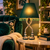 Emerald green Eve designer table lamp displayed on an accent table in a cozy reading nook