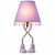 Lavender Eve designer table lamp softly illuminated on a white background with silver-tone legs and open-toe sandal feet