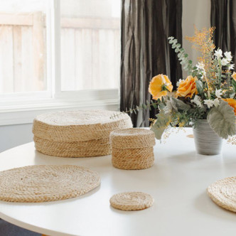 Set of 8 Handwoven Jute Round Coasters with natural tones and texture compliment an array of design aesthetic. Pair with our Placemat Set to complete your table setting.
