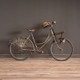 A charming vintage French bicycle in a child's or ladies' size, featuring an antique design with intricate details and rustic appeal. Perfect for adding nostalgic elegance to your interior decor.