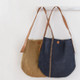 The Archer Jute Tote Bag in natural and indigo, a gorgeous accessory, with a jute canvas exterior and interior cotton lining, along with a strong, leather handle it's perfect for everyday use or trips to the farmer's market.