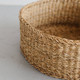 The Harvest round jumbo woven bowl is handcrafted from hogla grass, an aquatic plant. Woven together, it creates a design that's both lightweight and strong, with layers of natural texture and tone.