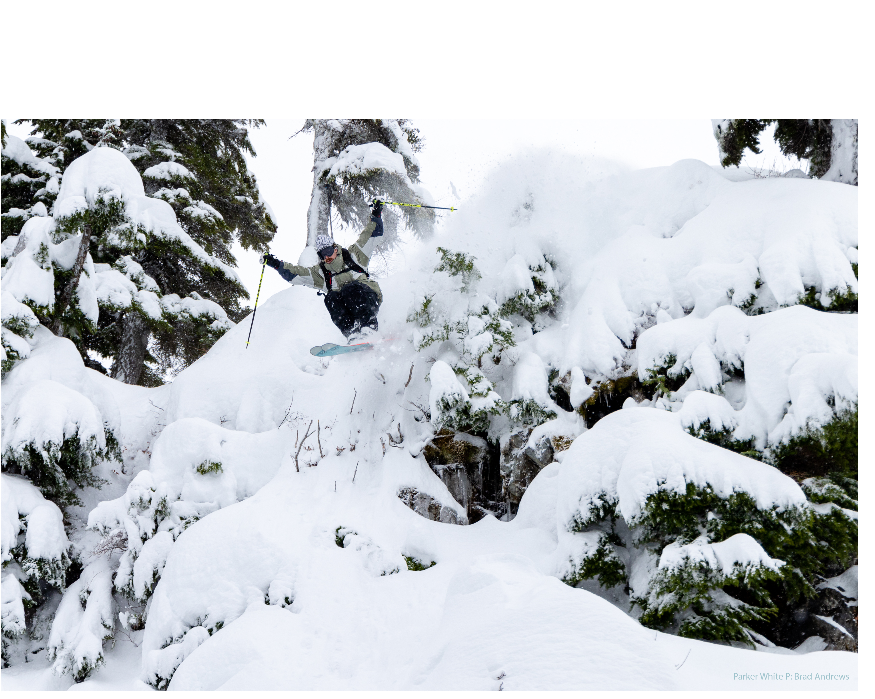 Parker White skiing in powder.