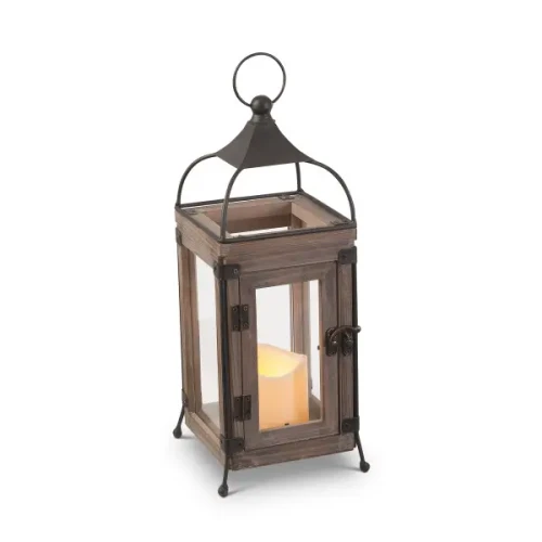 An industrial farmhouse style decorative metal lantern featuring a dark, rustic finish and clear glass panels