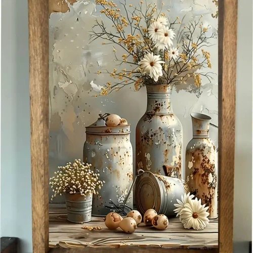 Rustic farmhouse wall sign featuring distressed vintage tin vases and containers filled with white wildflowers and dried stems arranged on a wooden tabletop in a natural wood frame.