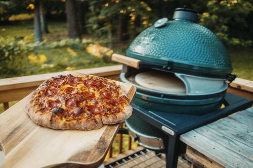 Big Green Egg XL Pizza Wedge accessory (SKU 136688) installed on an Extra Large EGG to create a front-facing slot for easy pizza sliding and heat retention.