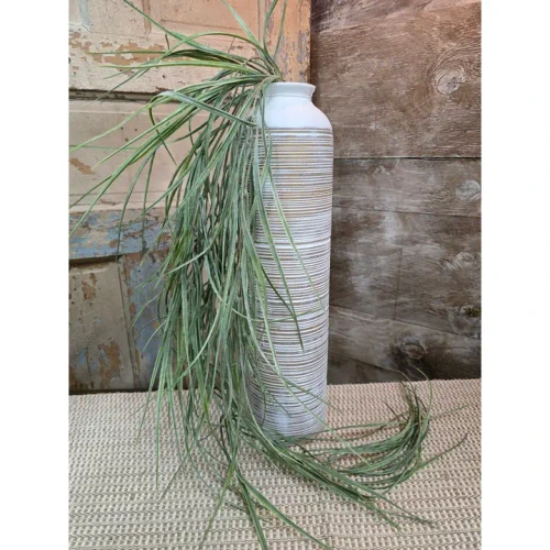 A long cascading artificial meadow grass pick with soft green wispy blades displayed in a white textured vase, perfect for farmhouse and botanical home décor.