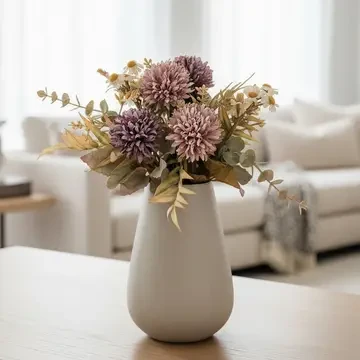 A 12-inch artificial Rose Chrysanthemum Stem featuring soft mauve blooms, eucalyptus, and muted greenery arranged in a white ceramic vase for elegant farmhouse décor.