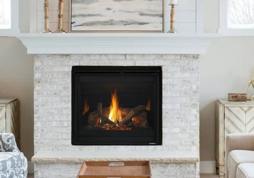 Front view of the Heat & Glo SlimLine 7X 36-inch direct vent gas fireplace showcasing its slender depth, glowing ember bed, highly detailed ceramic Birch logs, and mirror-like reflective black glass interior panels.