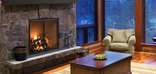 Front view of the Heat & Glo Rutherford 36-inch wood burning fireplace showing its massive glass-free open hearth, heavy-duty steel log grate, integrated spark screens, and premium molded refractory brick lining.