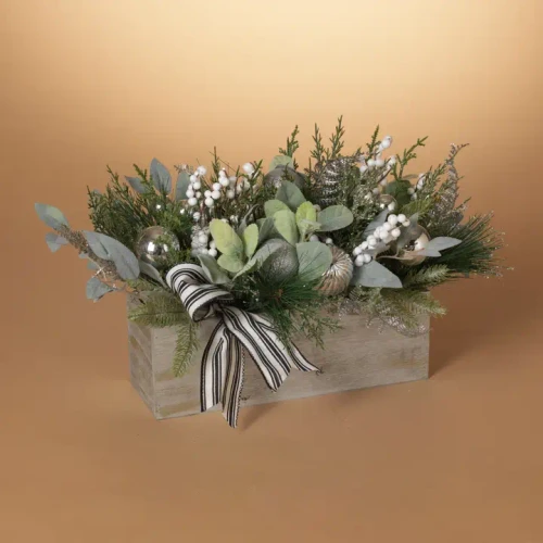 Holiday Pine and Berry Arrangement featuring lush pine sprigs, vibrant red berries, and natural accents in a seasonal tabletop display.