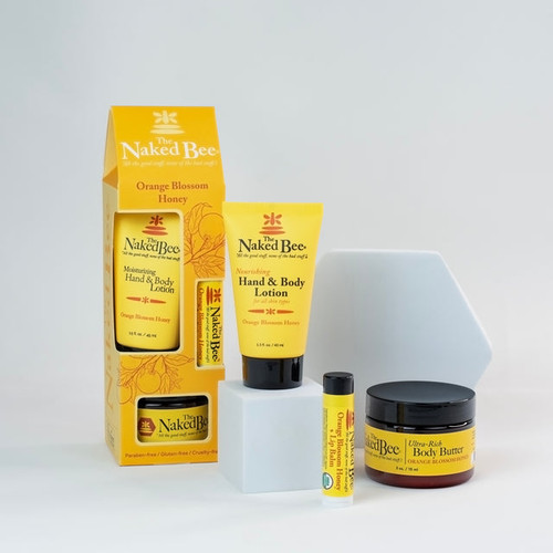 The Naked Bee Contemporary Orange Blossom Honey Gift Collection including hand lotion, ultra-rich body butter, and organic lip balm.