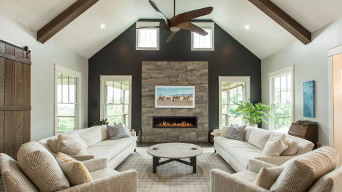 Front view of a Heat & Glo Mezzo 48-inch linear direct vent natural gas fireplace featuring a modern ribbon flame spreading across a glass media bed with reflective black glass interior panels.