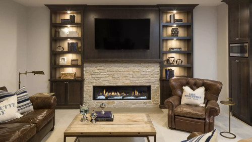 Front view of a grand Heat & Glo Mezzo 72-inch linear direct vent natural gas fireplace featuring an expansive ribbon flame spreading across a glass media bed with reflective black glass interior panels.