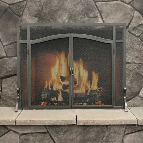 Pilgrim Forged Iron fireplace screen finished in black, featuring elegant arched double doors, hand-forged handles, and a heavy wire mesh spark guard.