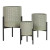 Cosima farmhouse planter featuring glossy sage green metal pot with an embossed geometric starburst pattern resting on minimalist black metal stands.