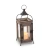 An industrial farmhouse style decorative metal lantern featuring a dark, rustic finish and clear glass panels
