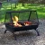 Heavy-duty black steel square outdoor fire pit featuring a deep crossweave patterned fire bowl, protective mesh spark screen, and safety outer rail.