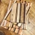 Large handcrafted Appalachian striped wooden cutting board featuring alternating light and dark hardwood grains, ideal for kitchen meal prep and serving.