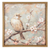 An elegant botanical artwork titled 'Bird on Luminous Bloom - I' depicting a detailed, small bird perched gracefully on a vibrant, softly glowing flower blossom.