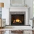 A traditional Heat & Glo 8K 42-inch direct vent propane gas fireplace showcasing a massive viewing window, vibrant yellow flames, and realistic glowing logs.