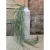 A long cascading artificial meadow grass pick with soft green wispy blades displayed in a white textured vase, perfect for farmhouse and botanical home décor.