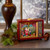 A retro-styled brown television set housing a lighted waterglobe inside, featuring Santa Claus surrounded by swirling glitter and illuminated by a warm LED glow.