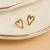 Delicate open-heart stud earrings crafted with a tarnish-resistant, waterproof finish for everyday wear.
