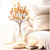 Vibrant artificial autumn bittersweet spray featuring realistic orange and yellow berries clustered along a flexible, rustic brown faux stem.