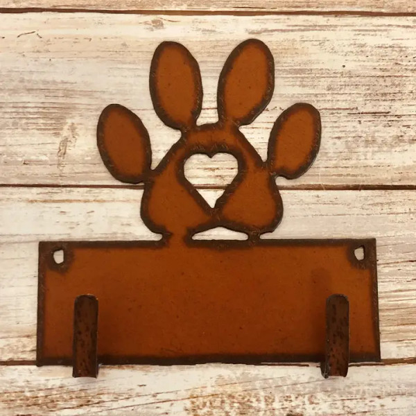 Rustic metal dog paw print with heart double hook leash holder for wall mounting.