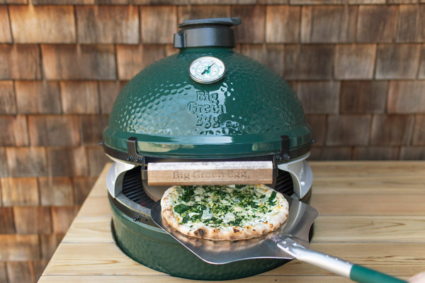 A set of two durable Big Green Egg Pizza Oven Wedges installed on a Large EGG, creating a front-loading opening for quick and easy pizza baking.