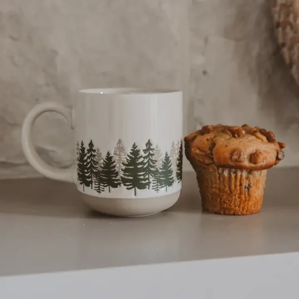 Cream-colored 14 oz forest stoneware coffee mug featuring a two-tone wraparound tree pattern in a rustic, nature-inspired design.