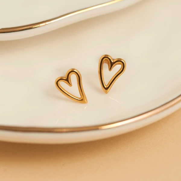 Delicate open-heart stud earrings crafted with a tarnish-resistant, waterproof finish for everyday wear.