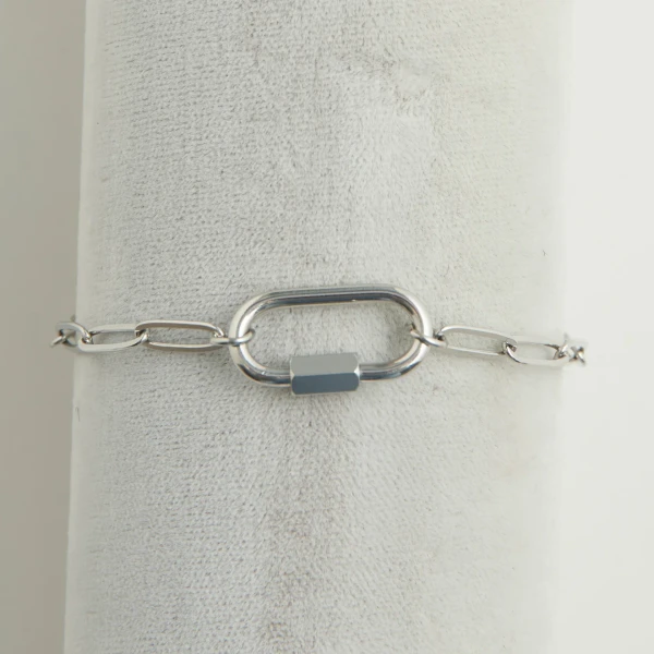 Close-up view of a waterproof stainless steel paperclip chain bracelet featuring a secure carabiner clasp against a clean neutral background.