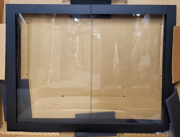 Clearance Custom Glass Fireplace Door (CL139) highlighting a sleek, minimalist Hidden Manhattan frame design in a premium Brushed Chrome finish with clear glass doors and no mesh.