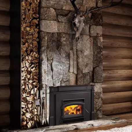Wood insert installed in a fireplace surround