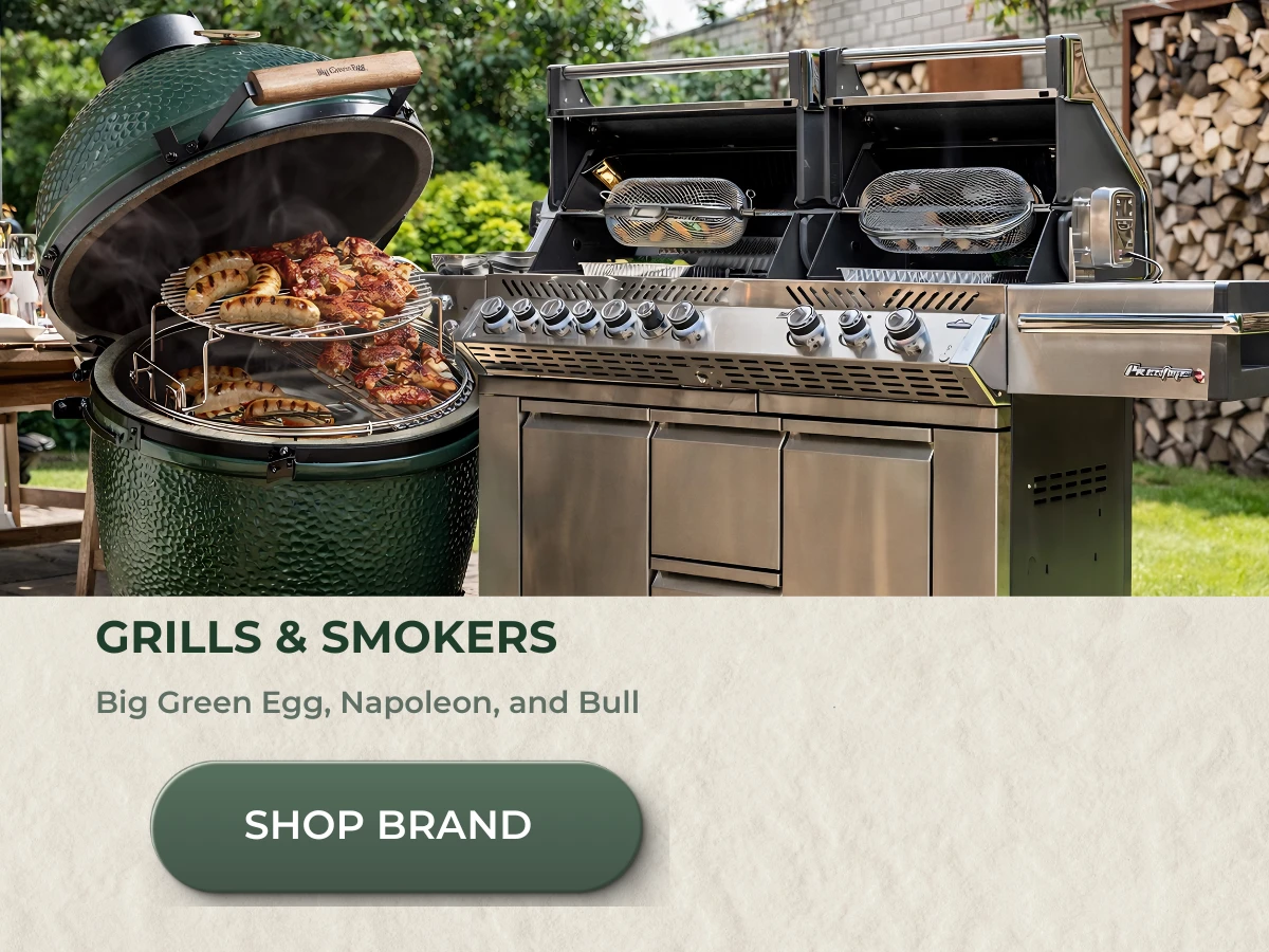 Grills and smokers including Big Green Egg and gas grill in Connecticut outdoor cooking setup