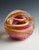 Flame Memorial cremains blown glass art, pink and gold Flame Memorial cremains blown glass art, pink and gold