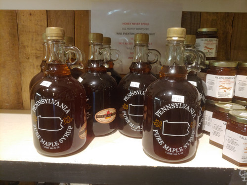 Jars of maple syrup on a shelf