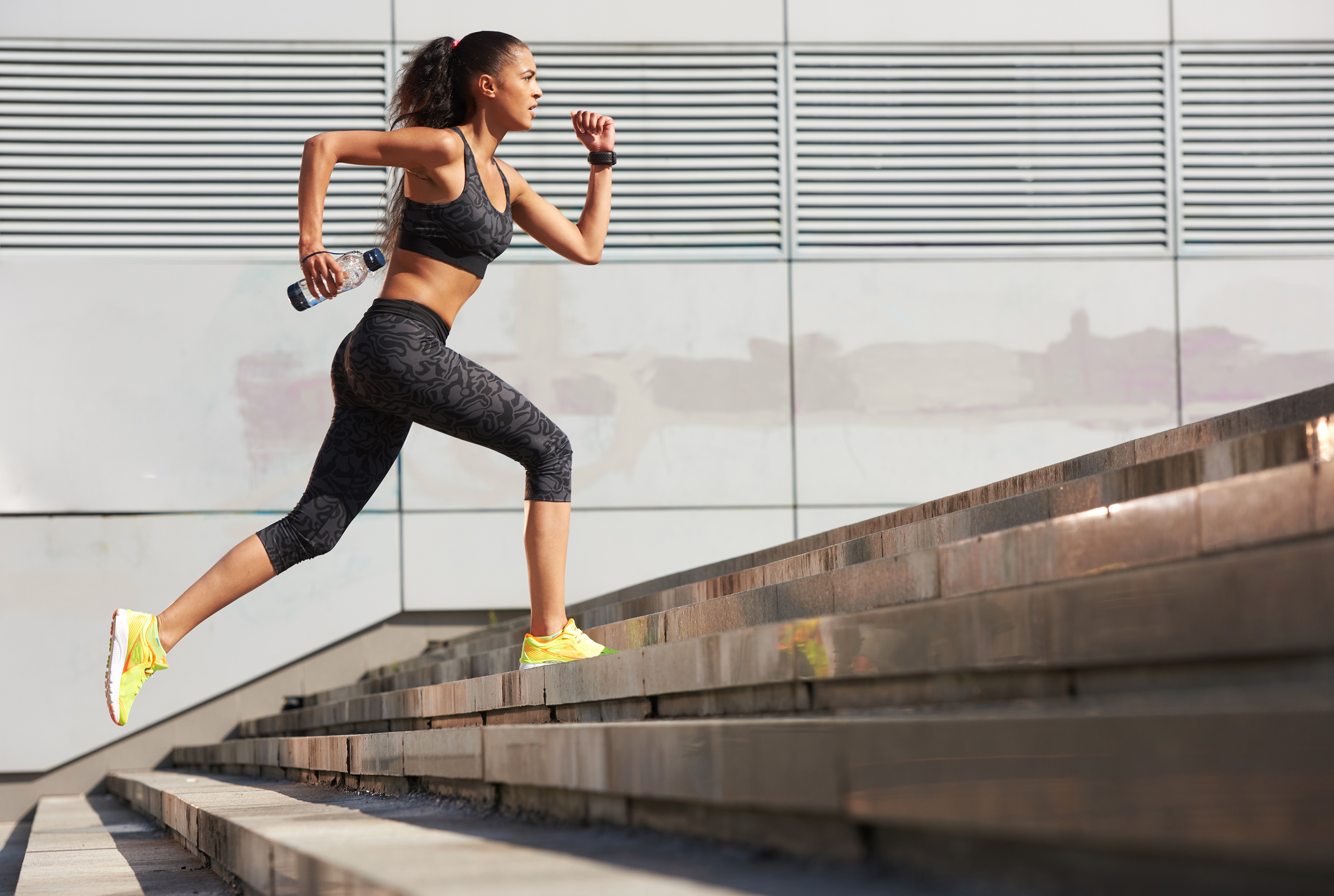 woman running up stairs