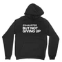 Exhausted But Not Giving Up (Black Pullover Hoodie)
