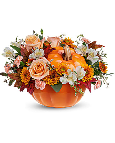 Welcome Fall into your home with this warm and cozy, Hello Pumpkin arrangement. The autumnal mix will add a sophisticated touch with crème roses combined with the warm hues of bronze chrysanthemums and peach mini carnations!