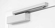 Dormakaba TS9315 track closer installed on door frame, aluminum finish, soffit-mounted arm configuration shown