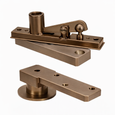 Norton Rixson 270 Series Center Hung Pivot Set in 611 Bright Bronze finish, showing top pivot assembly and bottom floor pivot components