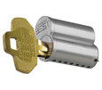 BEST CORMAX 1AM blank key shown partially inserted into a BEST interchangeable core cylinder, side profile view