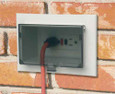 Arlington Industries Low Profile Recessed Electrical Box for New Brick Construction with Weatherproof In-Use Cover - Horizontal White with Clear Cover